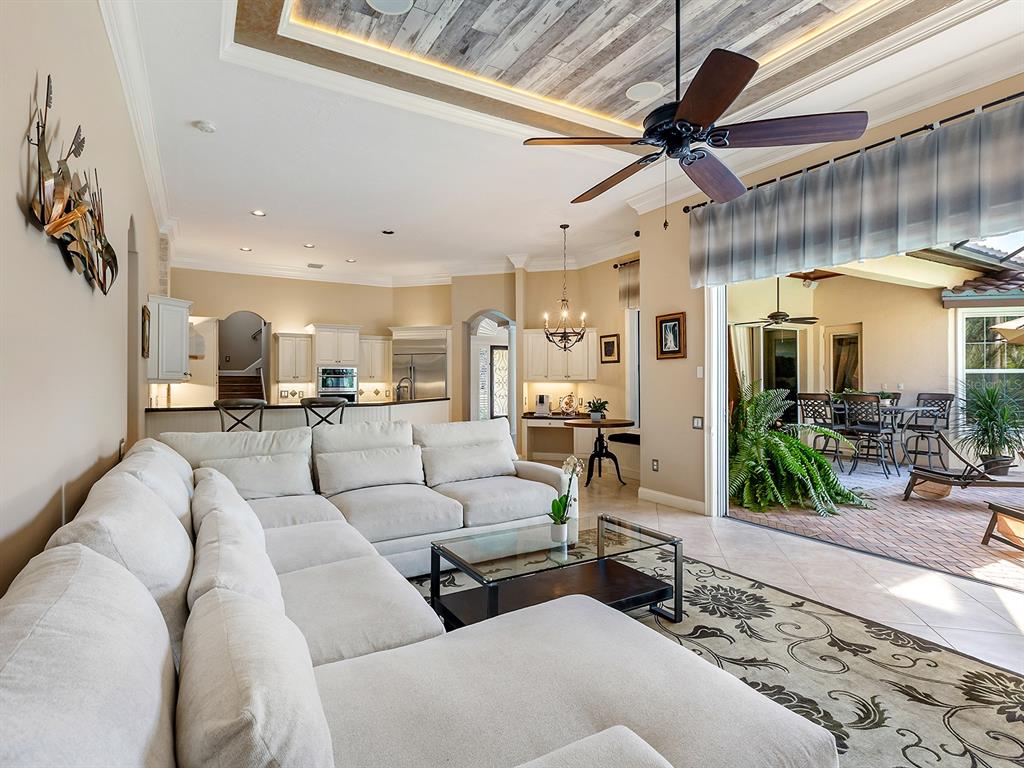 10528 Cheval Place Lakewood Ranch, FL 34202 - Photo 29 of 71 a living room with furniture and a large window