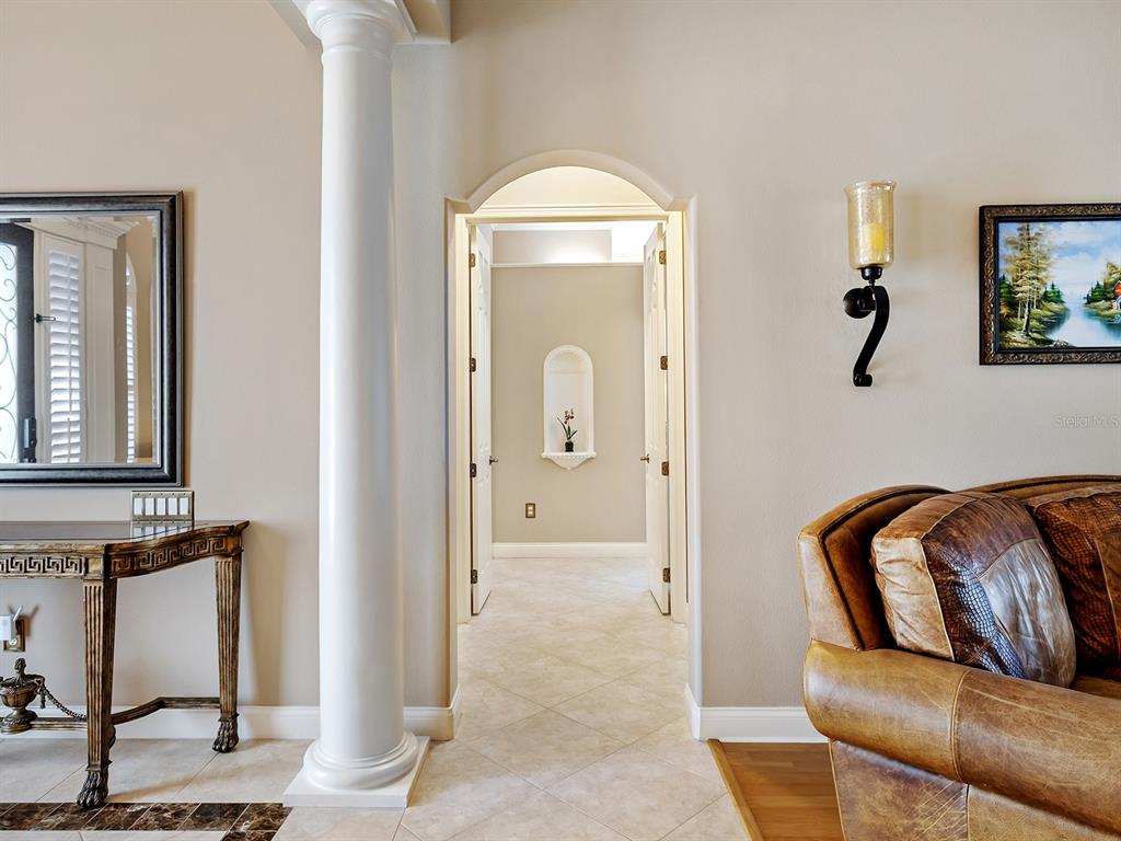 10528 Cheval Place Lakewood Ranch, FL 34202 - Photo 30 of 71 a living room with furniture and a window