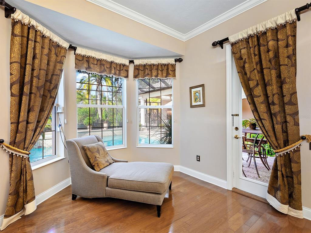 10528 Cheval Place Lakewood Ranch, FL 34202 - Photo 32 of 71 a living room with furniture and a window
