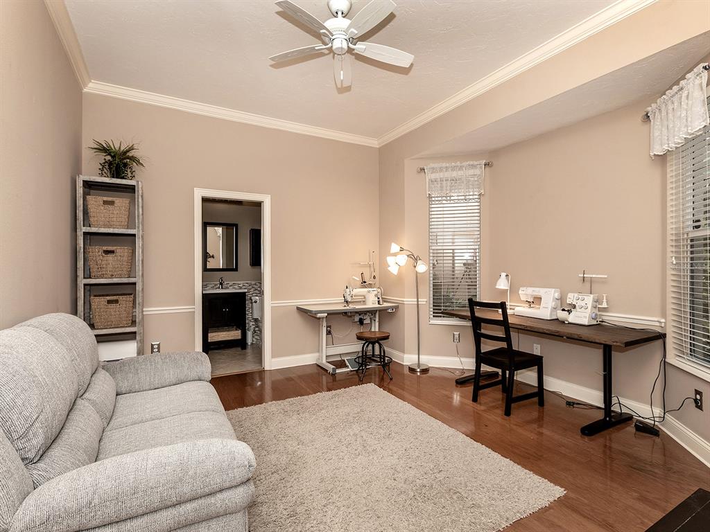 10528 Cheval Place Lakewood Ranch, FL 34202 - Photo 40 of 71 a living room with furniture a rug and a window