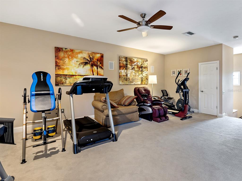 10528 Cheval Place Lakewood Ranch, FL 34202 - Photo 44 of 71 a living room with furniture a air conditioner vent and a window