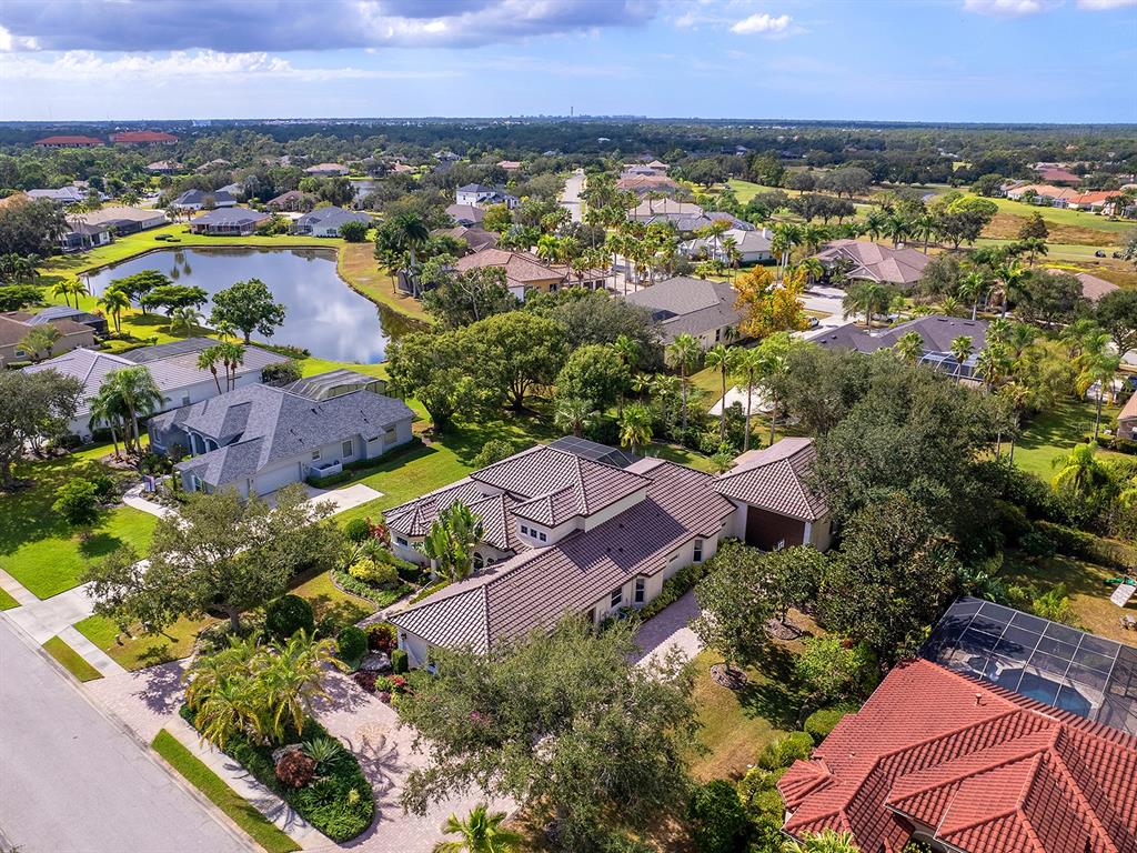 10528 Cheval Place Lakewood Ranch, FL 34202 - Photo 5 of 71 an aerial view of residential houses with outdoor space and seating area