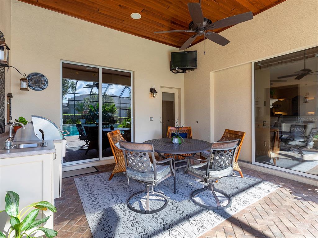 10528 Cheval Place Lakewood Ranch, FL 34202 - Photo 54 of 71 a view of a dining room with furniture window and outside view