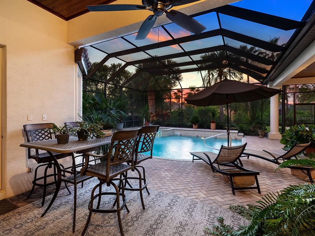 10528 Cheval Place Lakewood Ranch, FL 34202 - Photo 58 of 71 a view of a backyard with sitting area