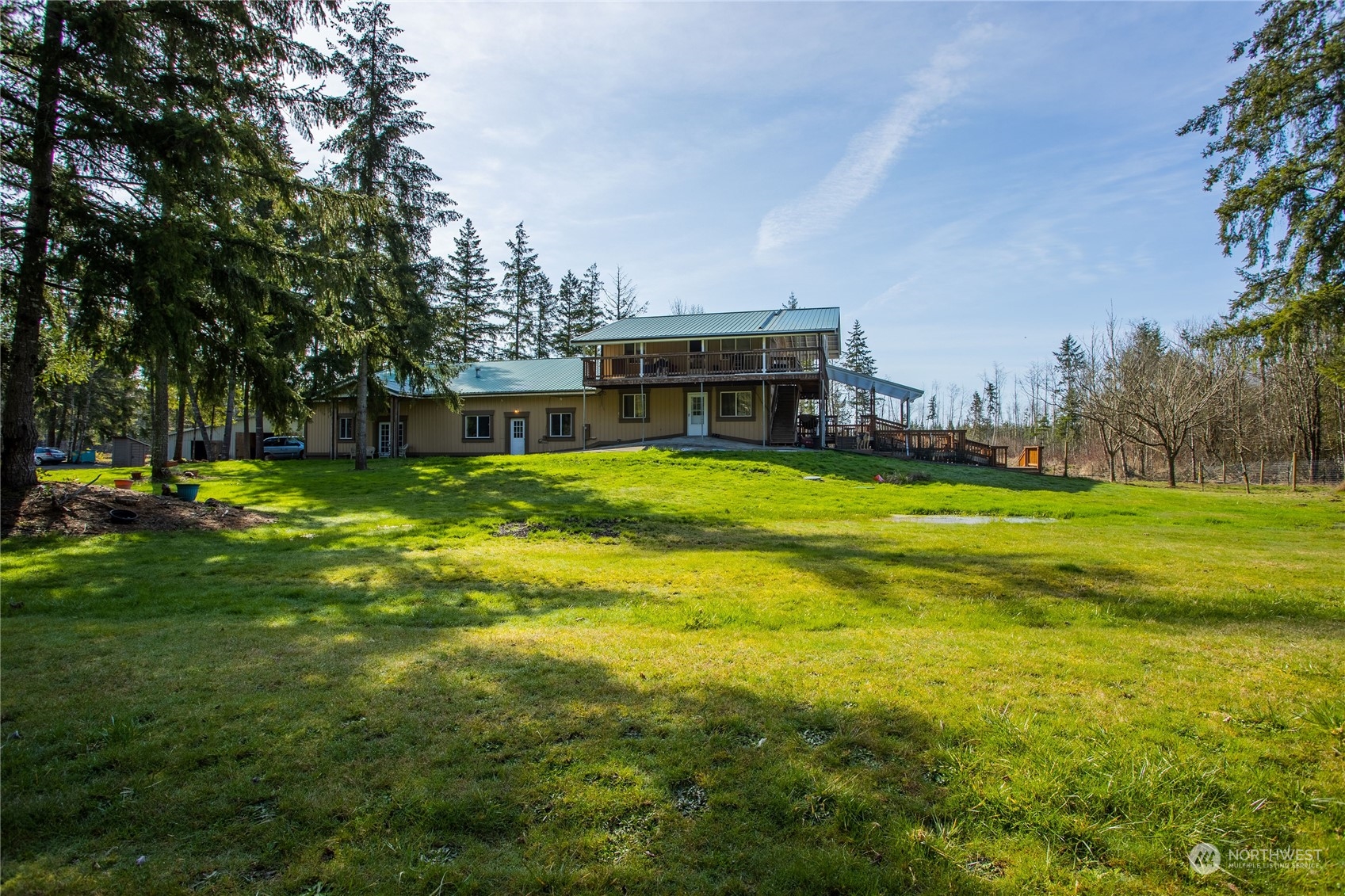 411 Zandecki Road Chehalis, WA 98532 - Photo 3 of 40 a view of a house with a big yard and large trees