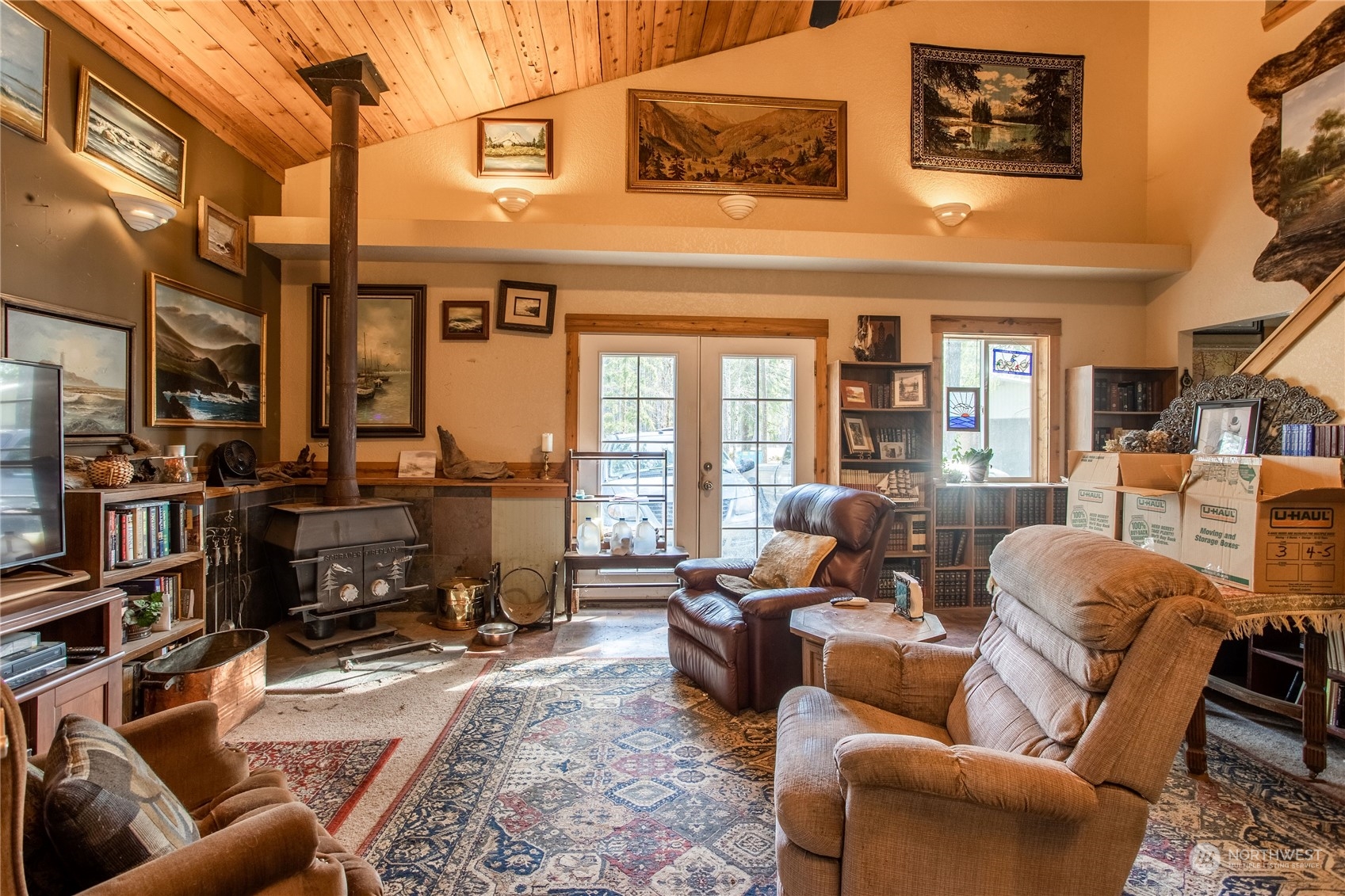 411 Zandecki Road Chehalis, WA 98532 - Photo 8 of 40 a living room with furniture a lamp and a floor to ceiling window