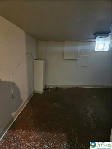 a view of an empty room with windows