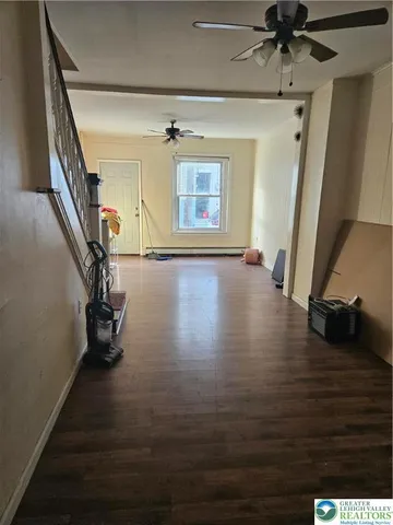 a view of an entryway with wooden floor