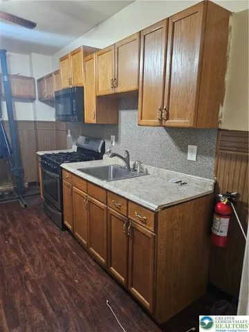 a kitchen with a sink and cabinets