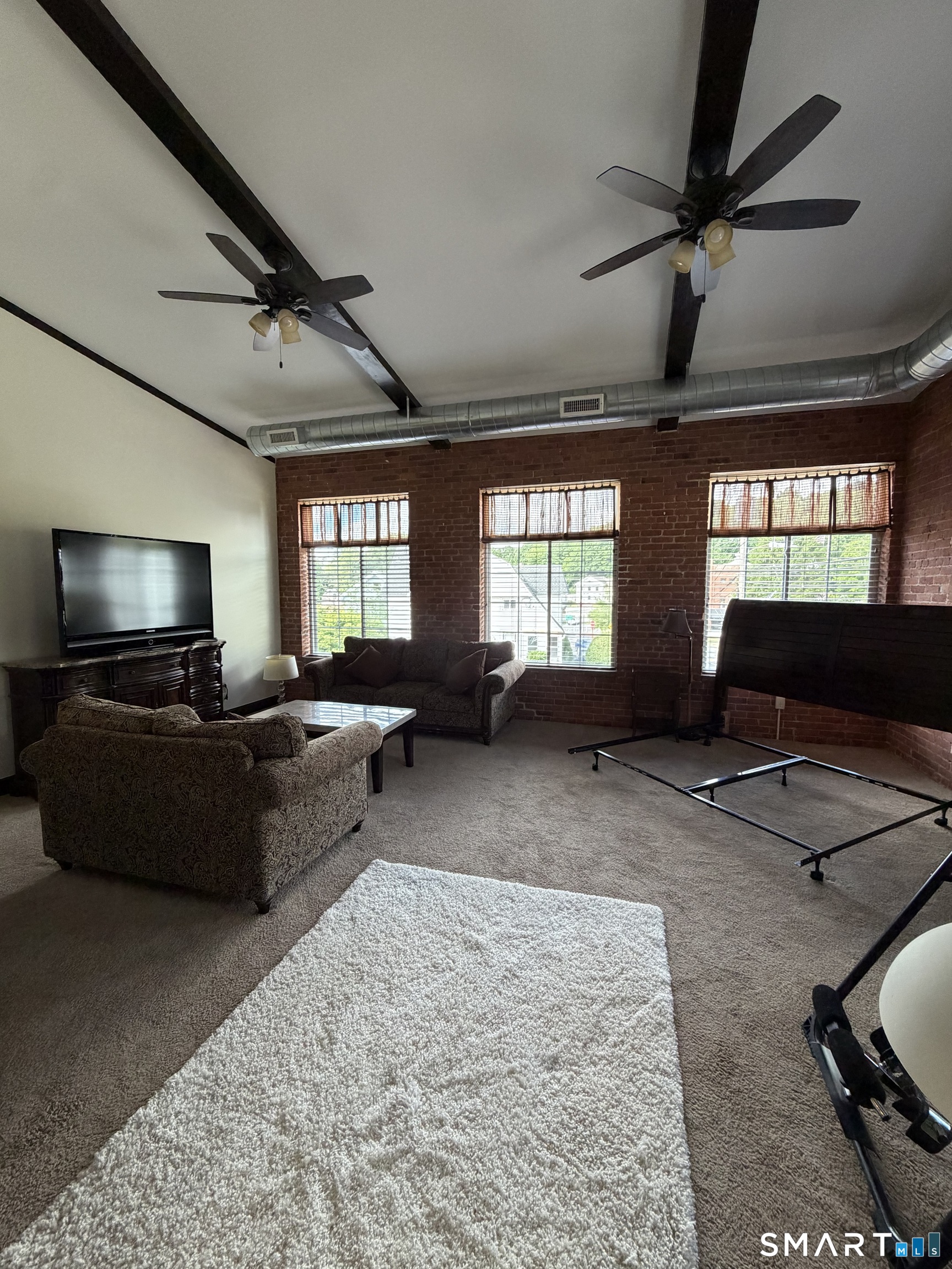 10 Summit Street, Unit 1 East Hampton, CT 06424 - Photo 8 of 14 a living room with furniture and a flat screen tv