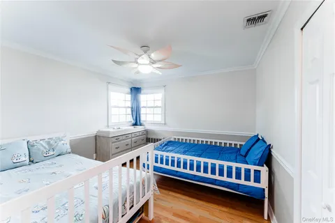 a bedroom with furniture and a window