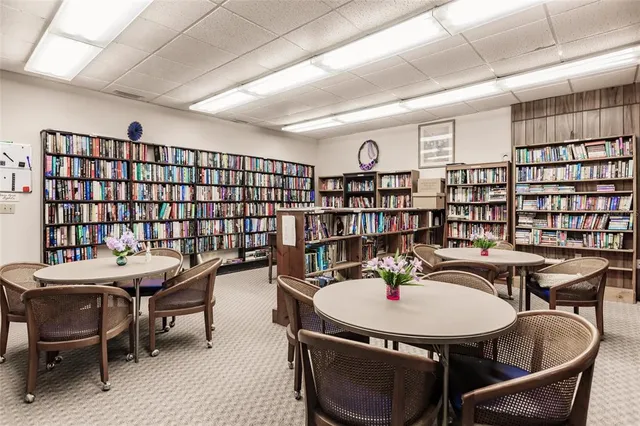 a workspace with furniture and a book shelf
