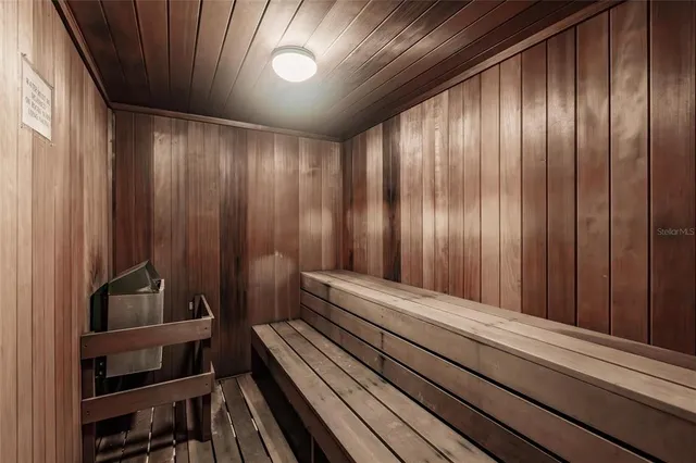 a room with pool table and windows