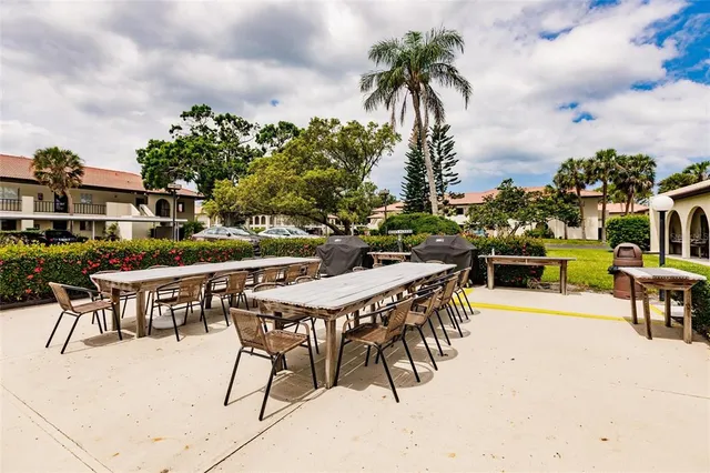 a view of swimming pool with outdoor seating and a pathway