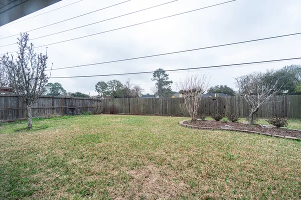 a backyard of a house with lots of green space