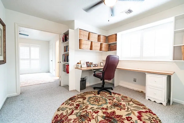 a workspace with furniture and window