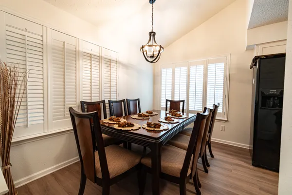 a view of a dining room with furniture and window