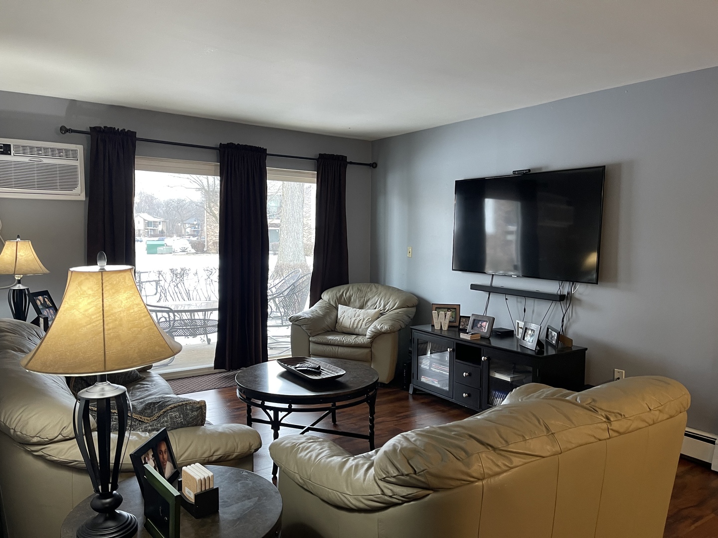 9-s116 S Frontage Road, Unit 27104 Darien, IL 60527 - Photo 5 of 15 a living room with furniture and a flat screen tv