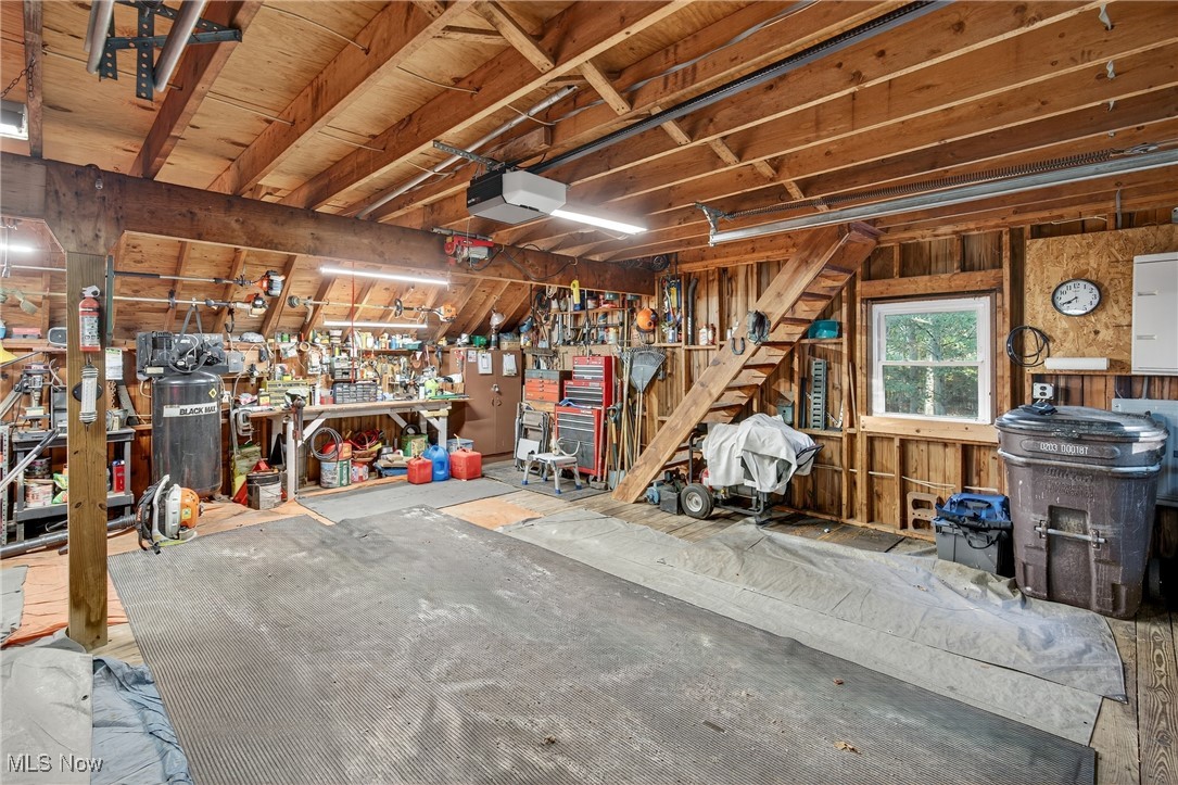 25700 Winona Road Homeworth, OH 44634 - Photo 30 of 49 Garage featuring a workshop area and a garage door opener