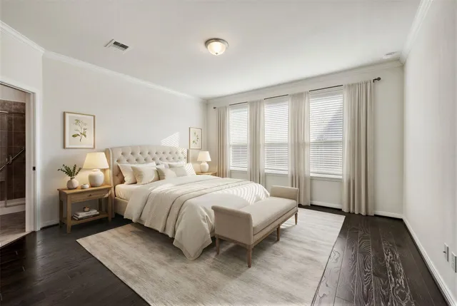 a spacious bedroom with a large bed and a large window