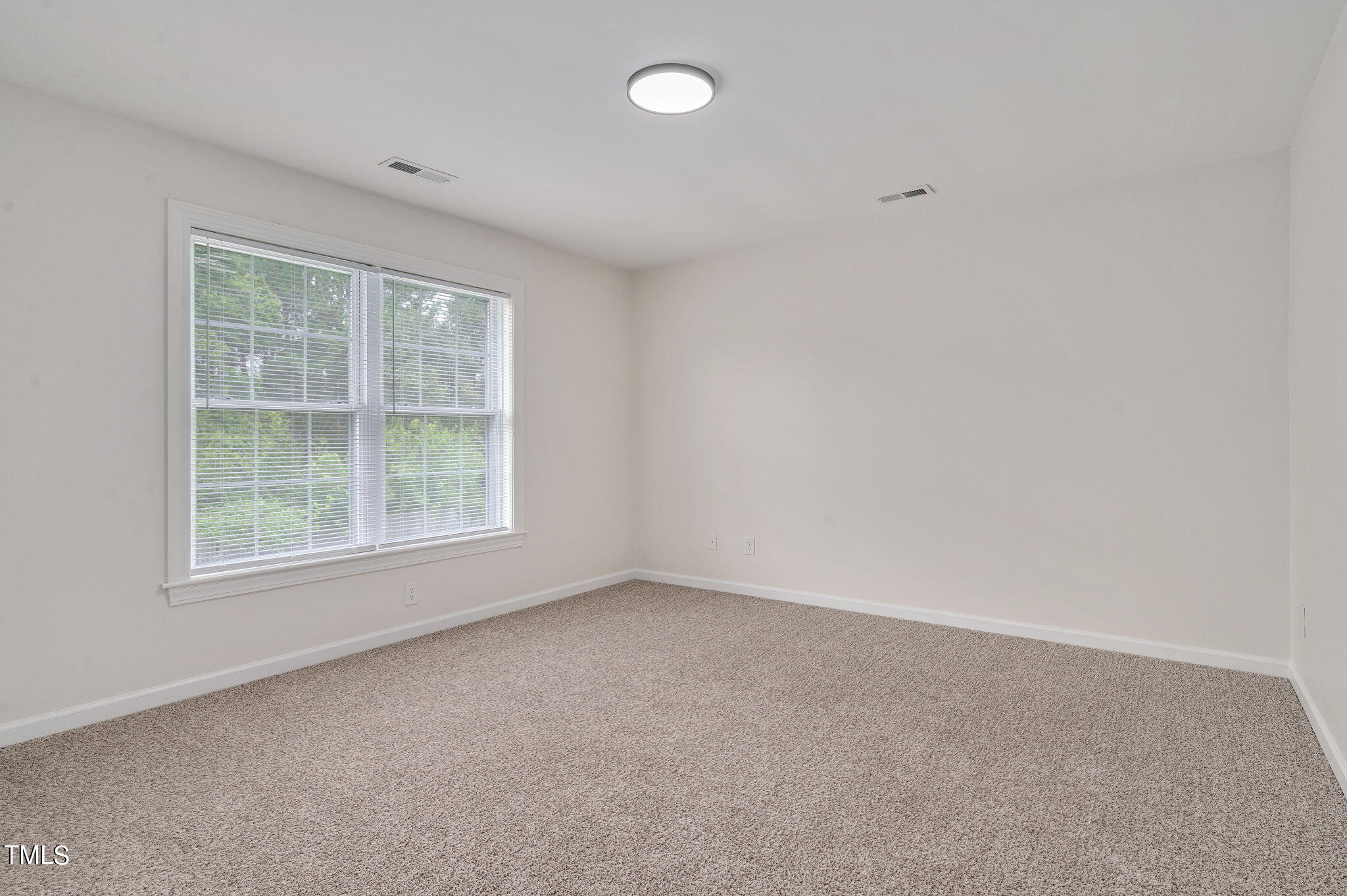3912 Kildaire Farm Road Apex, NC 27539 - Photo 28 of 37 an empty room with a window