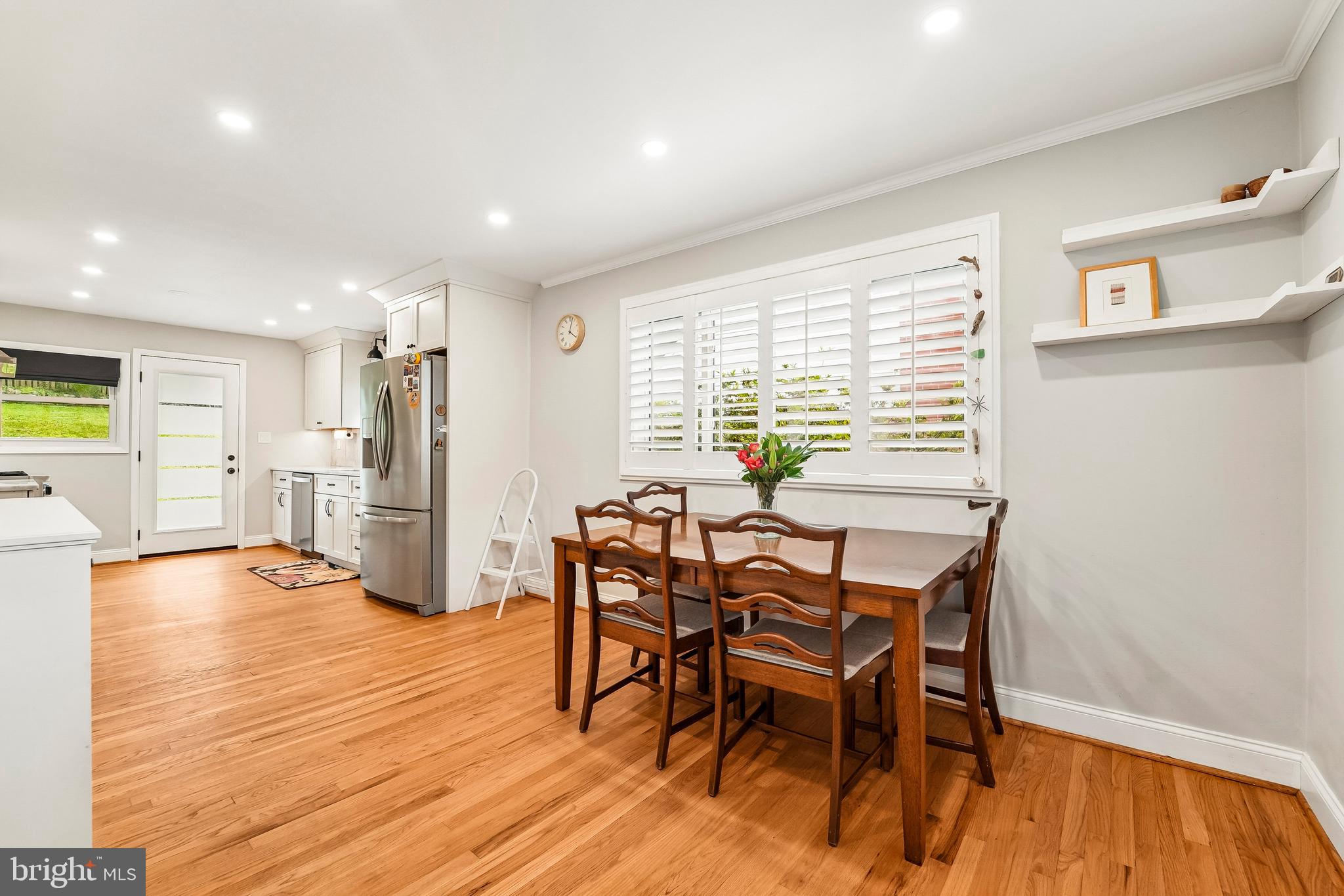 6640 Loch Hill Road Baltimore, MD 21239 - Photo 3 of 35 a view of a dining room with furniture and wooden floor