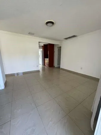 a view of a livingroom and window