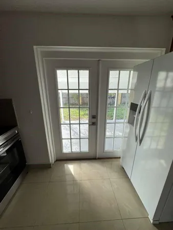 a view of an empty room with a fireplace