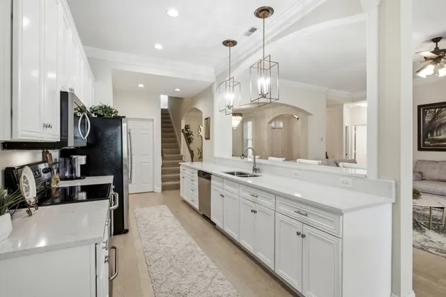 a large kitchen with a lot of counter space and a sink