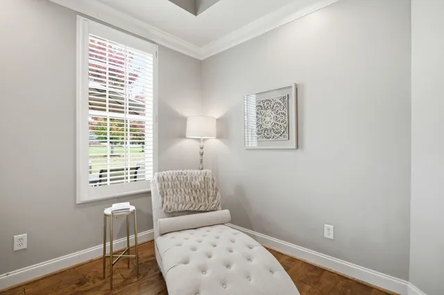 a bedroom with a bed and a lamp with window