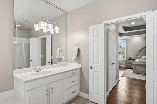 a bathroom with a double vanity sink and a mirror