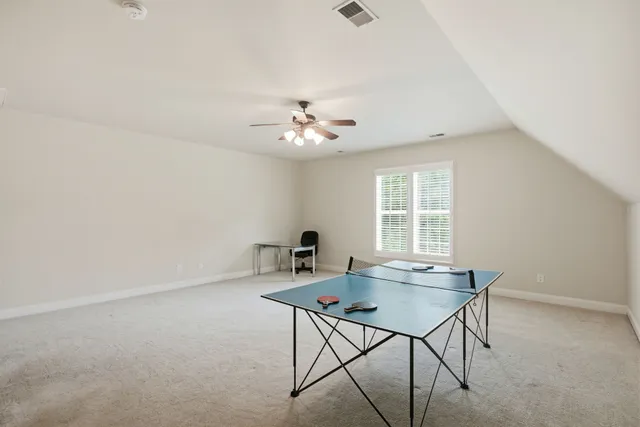 a workspace room with furniture and window