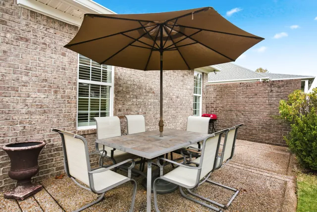 a view of a patio with furniture