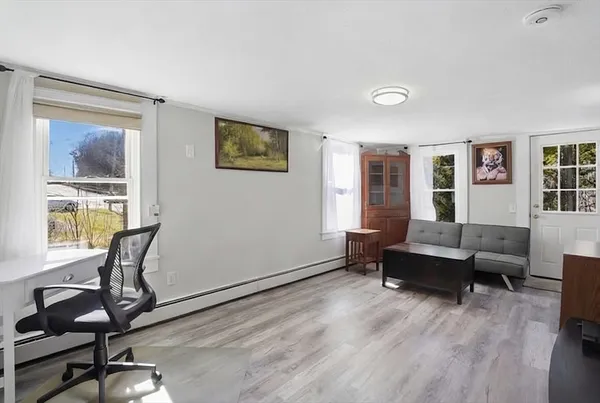 a view of a livingroom with furniture and windows