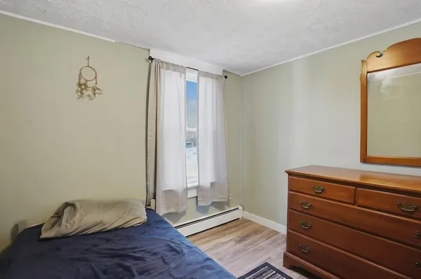 a view of room with wooden floor