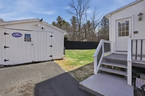 a view of a porch with wooden floor and fence