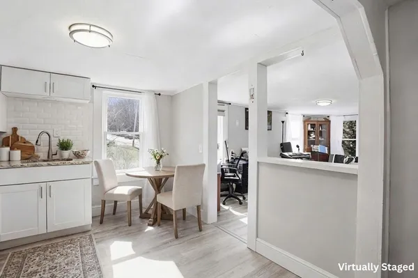 a kitchen with stainless steel appliances kitchen island granite countertop a sink and cabinets
