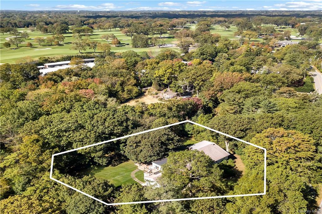 Aerial view of property adjacent to the golf
