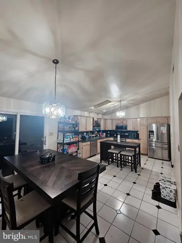 a bedroom with a bed and a night stand