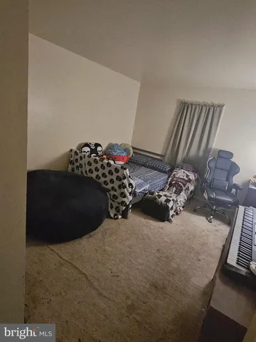 a bathroom with a sink and shower curtain