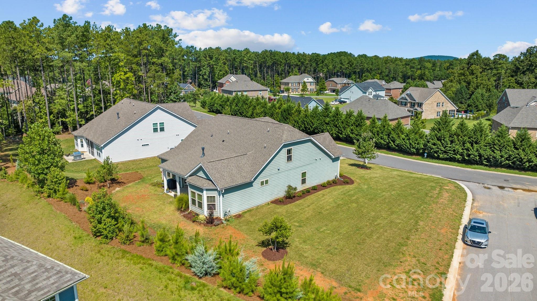 4697 Rinaldo Road York, SC 29745 - Photo 32 of 37 an aerial view of a house with swimming pool and large trees