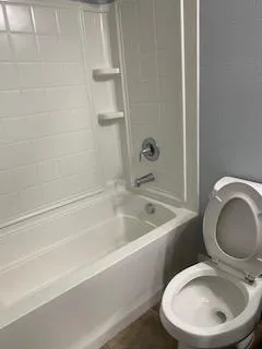 a bathroom with a sink a toilet and a bathtub