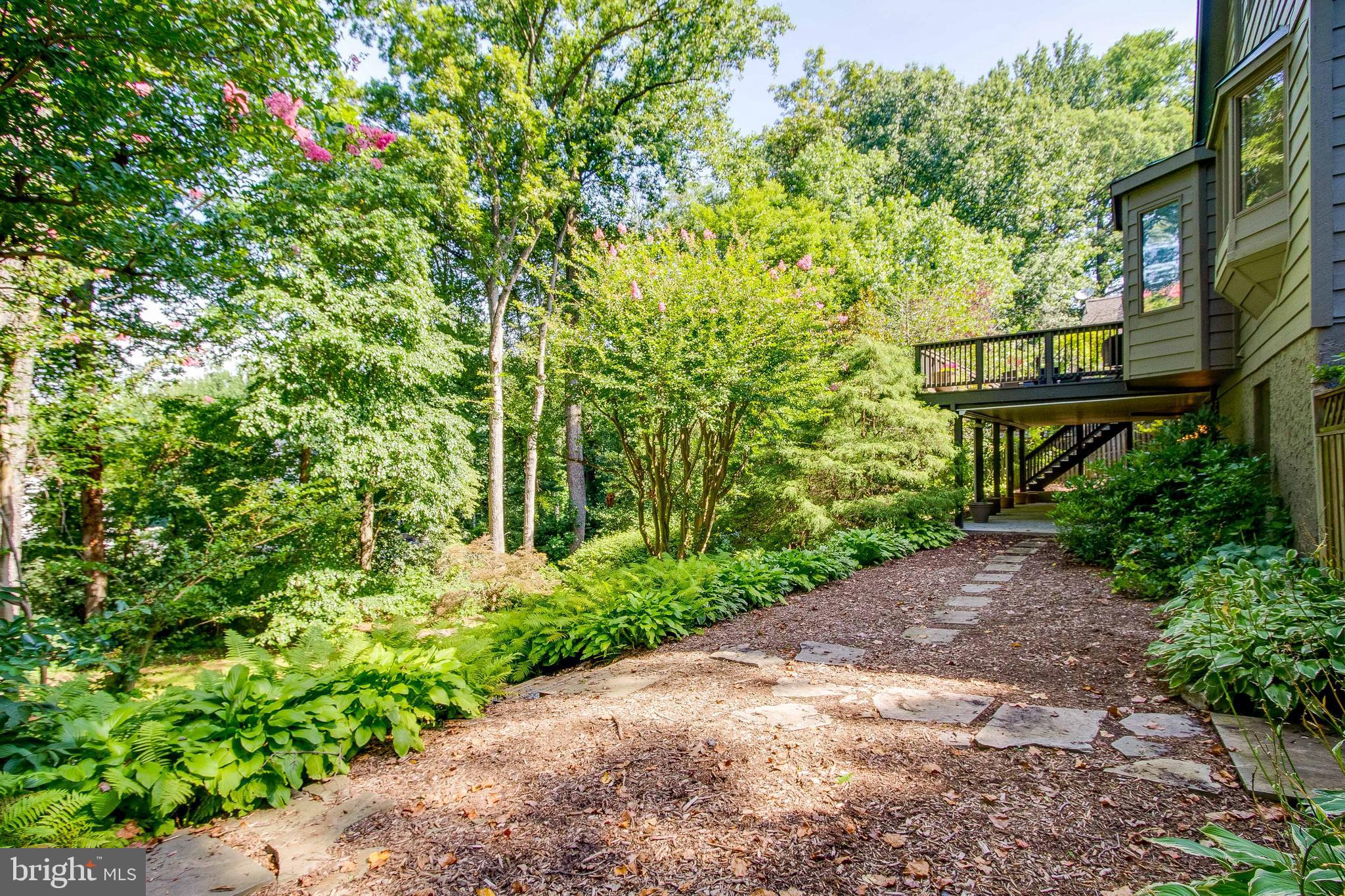 7346 Hooking Road McLean, VA 22101 - Photo 48 of 53 path from patio beneath deck to lovely grounds.