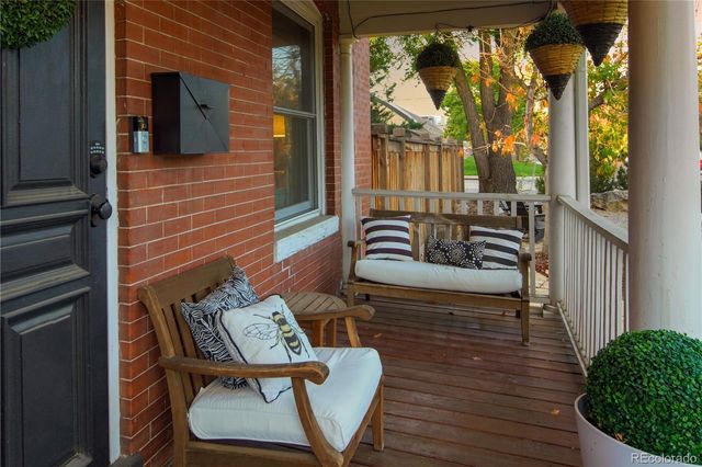 a living room with furniture a window and a fireplace