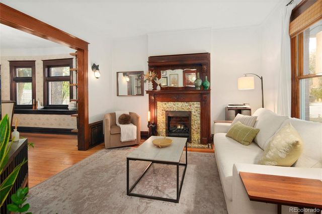 a living room with furniture and entryway