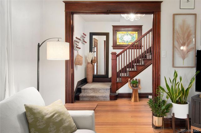 a dining room with a wooden table and chairs