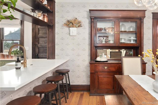 a kitchen with stainless steel appliances a sink and a refrigerator