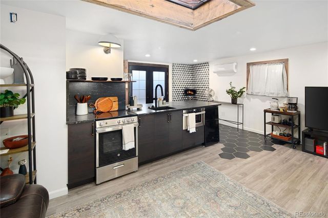 a bedroom with a large bed and a large window