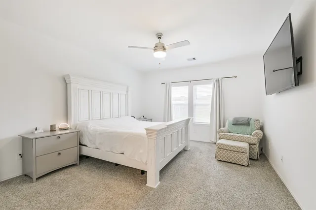 a room with a bed and a window