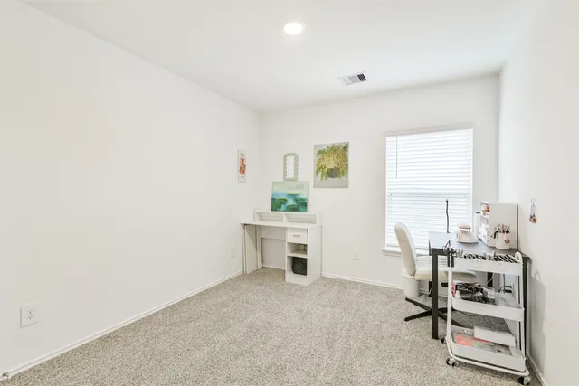 a workspace with furniture and window